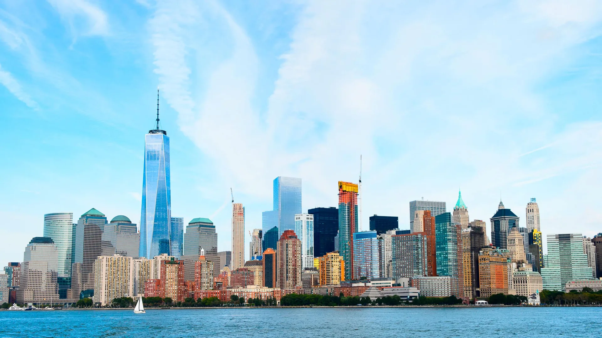 View of Lower Manhattan’s commercial skyline and office towers overlooking New York Harbor.