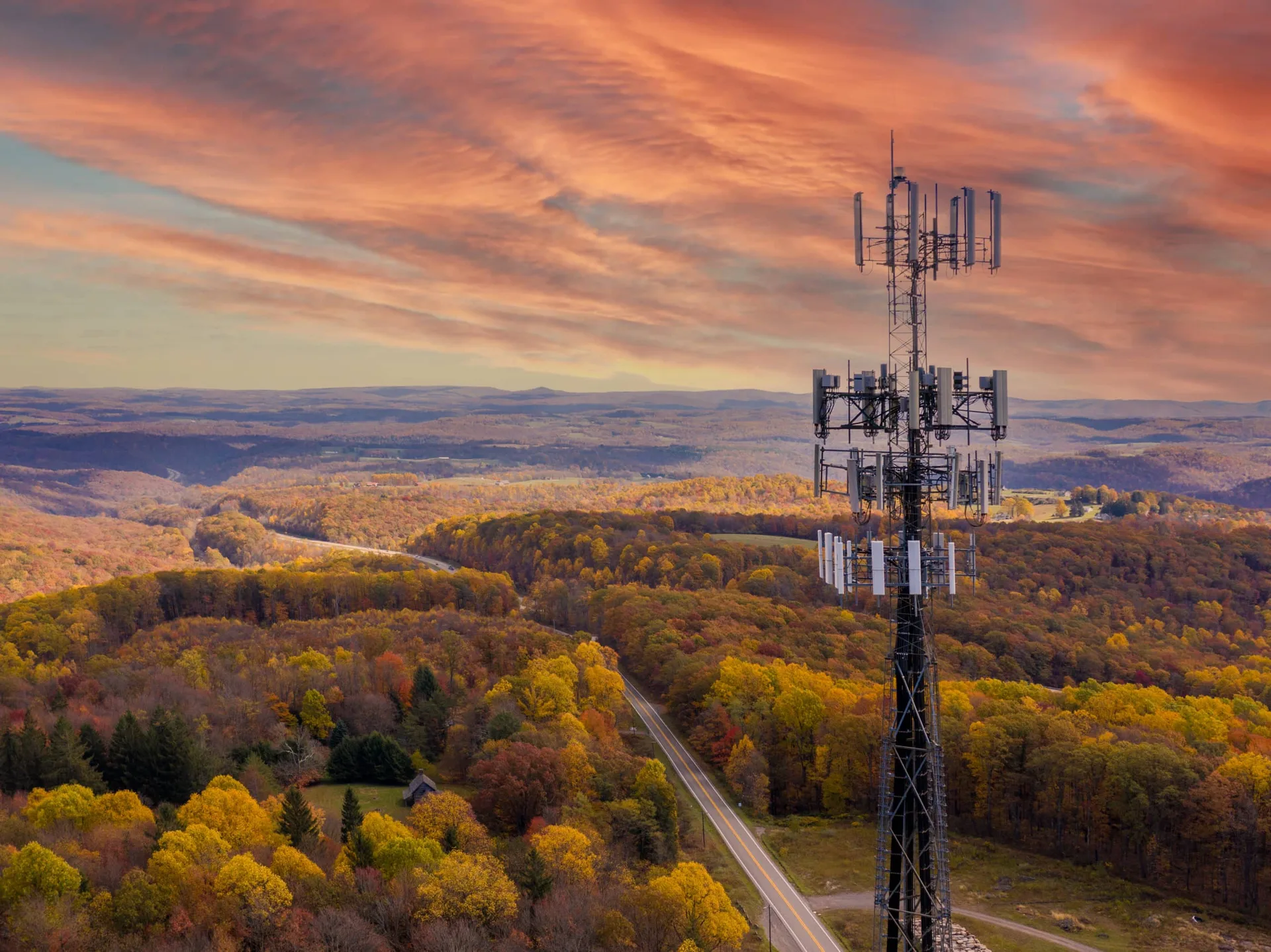 Aerial,View,Of,Mobile,Phone,Cell,Tower,Over,Forested,Rural