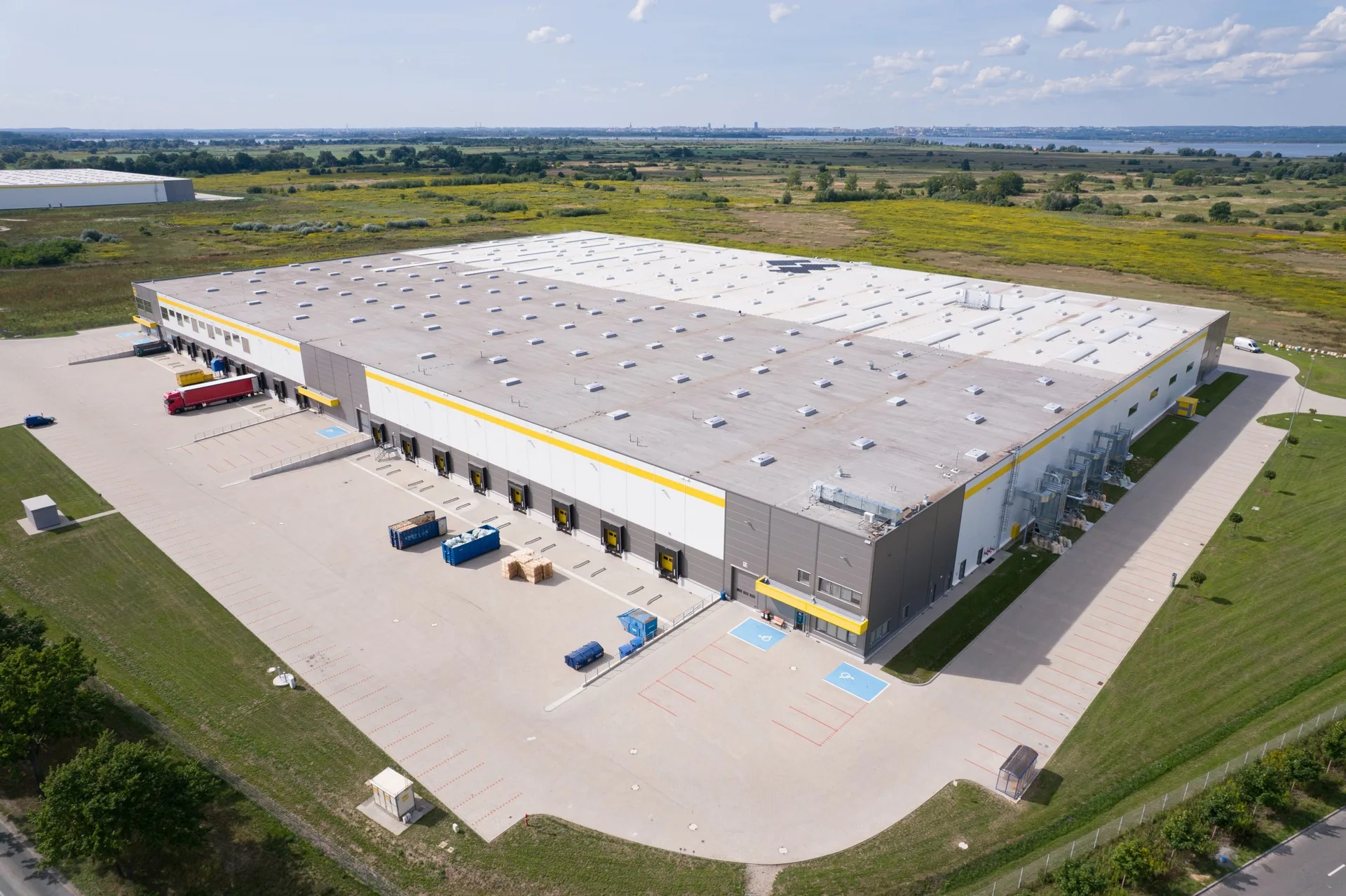 Industrial warehouse with truck loading docks illustrating zoning and operational considerations for logistics properties